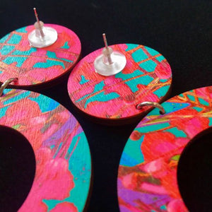 The same print on the backside of the hoop earrings, pink flowers on turquoise background